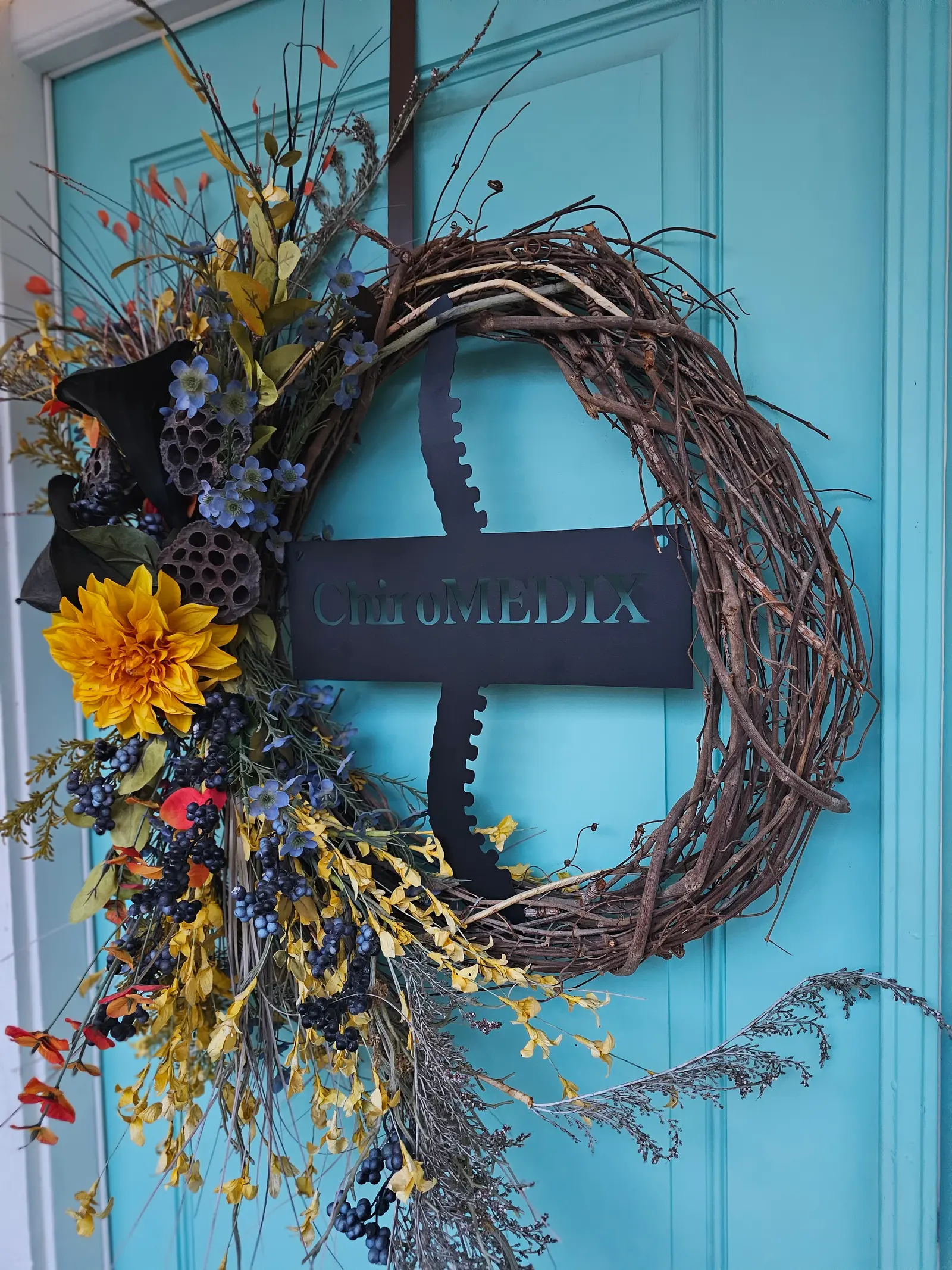 A wreath on the clinic’s turquoise front door